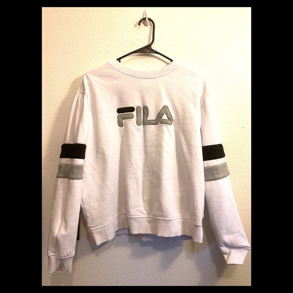 White Fila sweatshirt with black and gray strips on the arms. Size XL